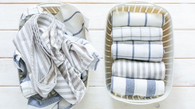 how to get organized - laundry baskets with nicely folded clothes inside