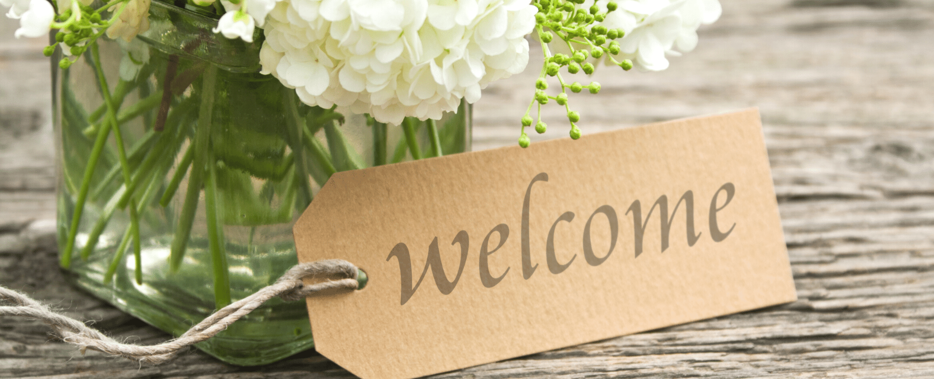 welcome note with flowers from Finally Family Homes