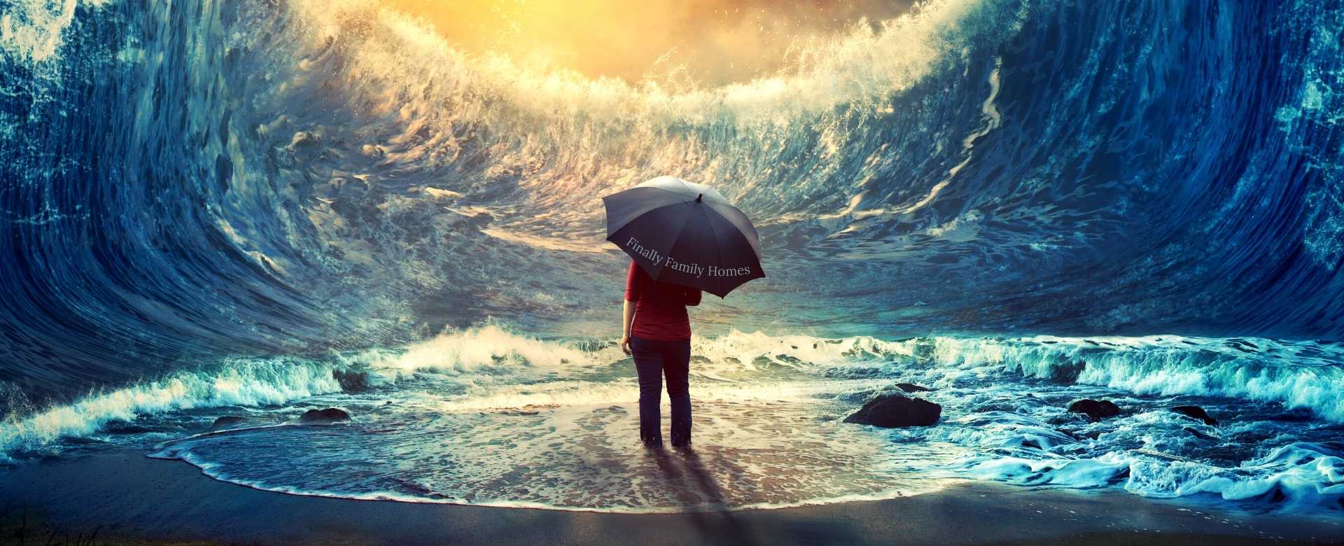 young woman standing in the middle of tall waves holding an umbrella