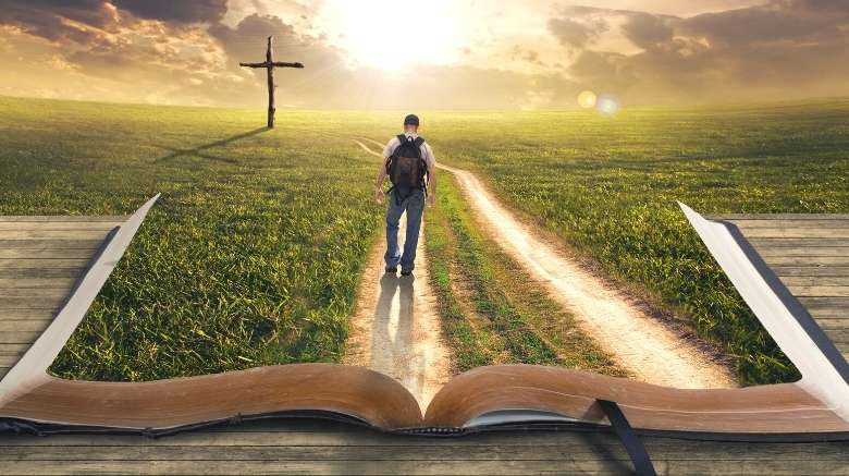 bible verses about hope represented as man walking on a path through the bible to the cross