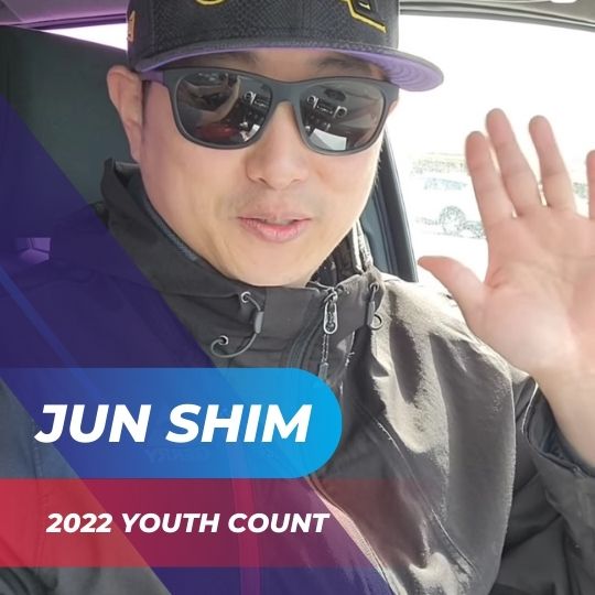 Jun Shim waiving while participating in the 2022 Youth Count with Finally Family Homes.