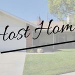host home written over image of a house from the oustide with white garage and green yard