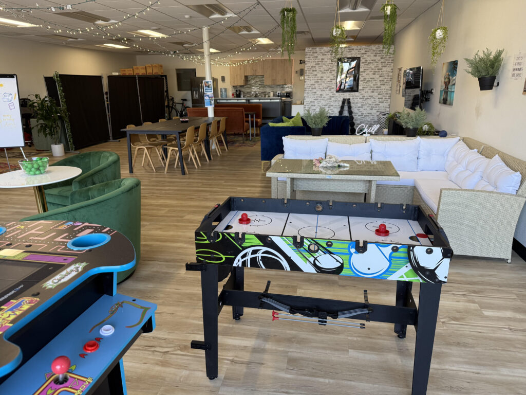 Oasis resource center Santa Clarita with a cool welcoming environment tables and chairs with computers, air hockey, video games
